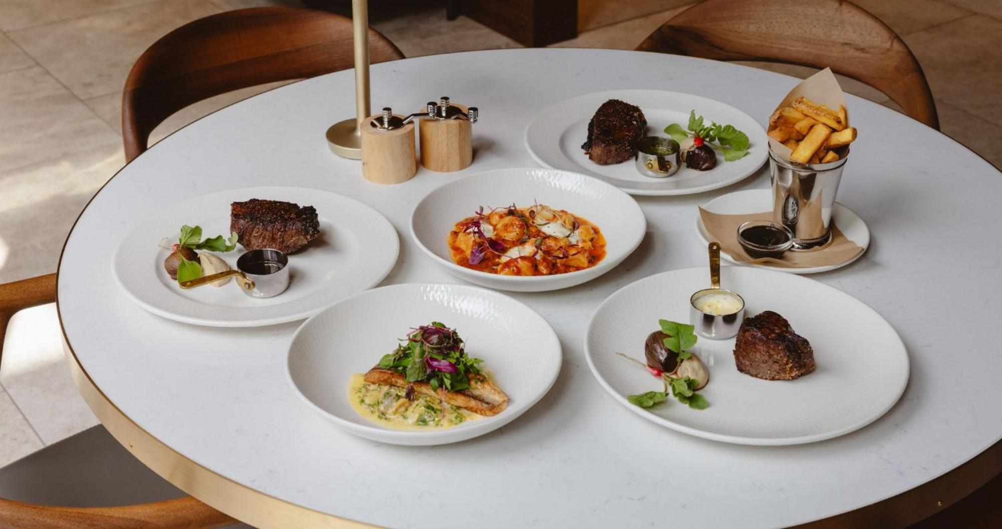 Horizon By Skycity Auckland Exterior photo Dishes at the restaurant